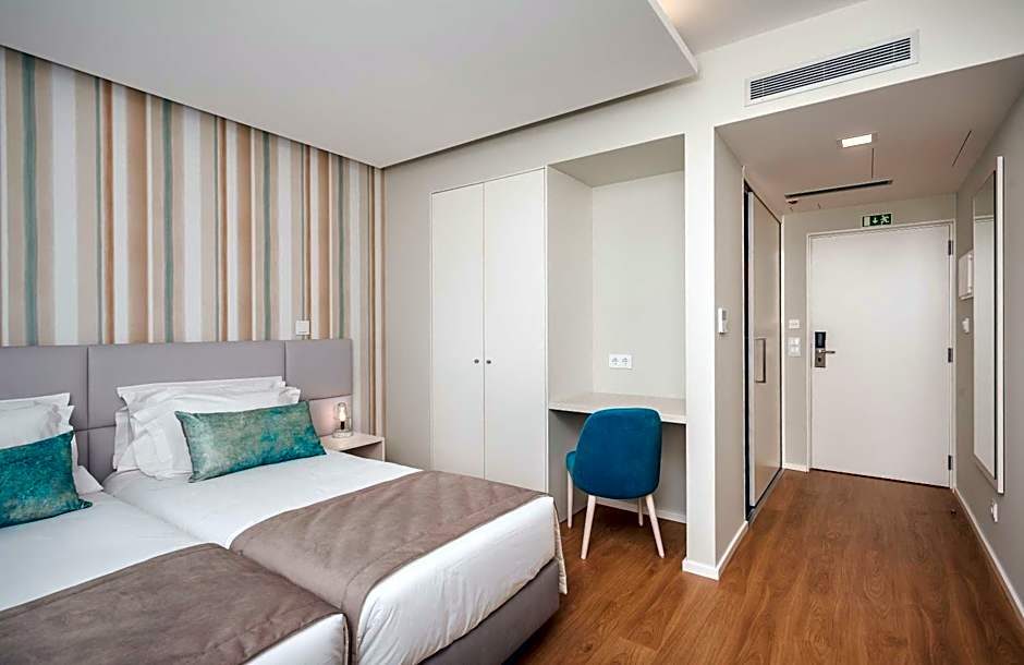 Essence Inn Marianos Hotel