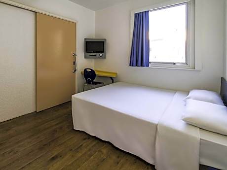 Standard Room with one double bed and one overhead bunk