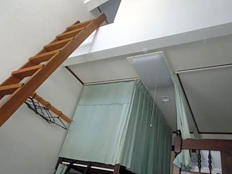 Single Bed in Dormitory Room