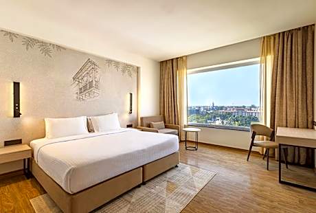 Deluxe Room with Complimentary Shuttle Pickup and Drop to Sai Baba Temple and Guaranteed early check in and late Check out upto 3 hours (Subject to availability)