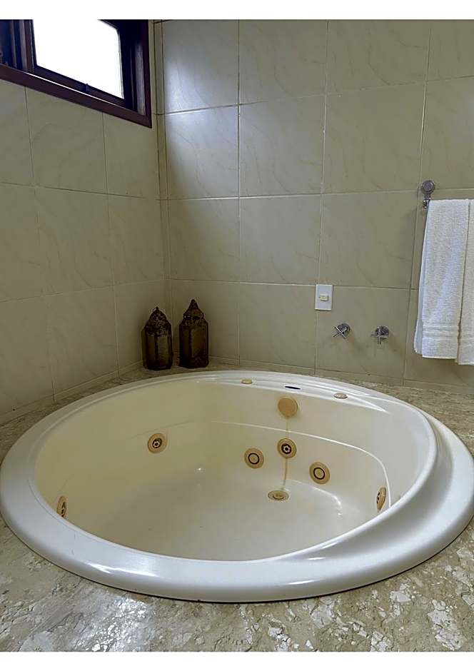 Casa Ilha| beira mar, piscina aquecida, 4 suítes