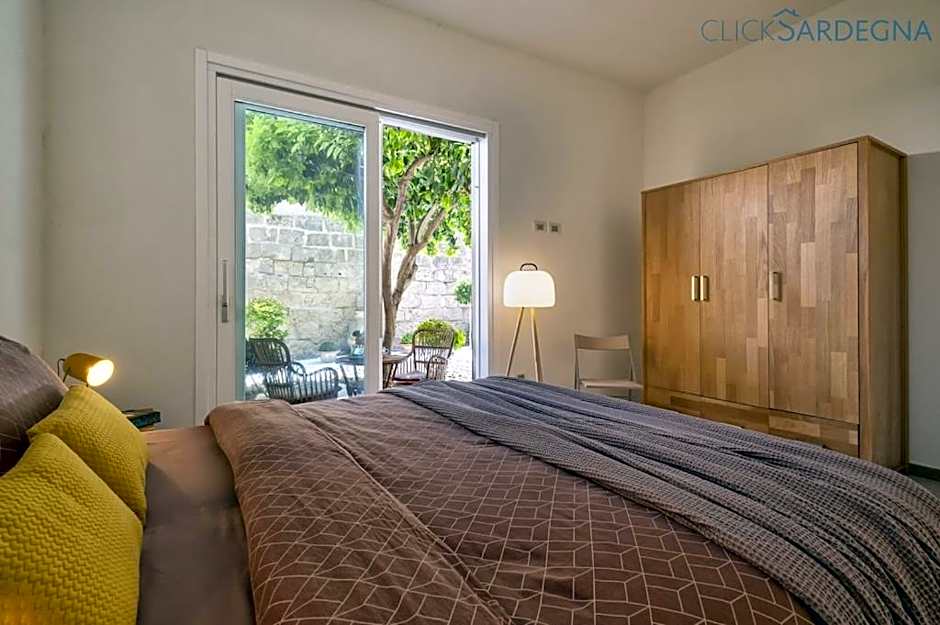 ClickSardinia Alghero Spectacular waterfront Neptune apartment with sea-facing terraces and garden