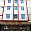 Capital O 90897 Island City Hotel