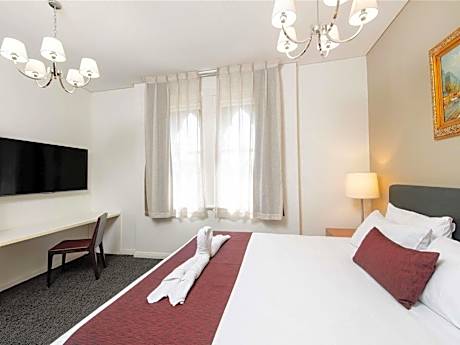 Family Room with One King Bed and Two Double Beds