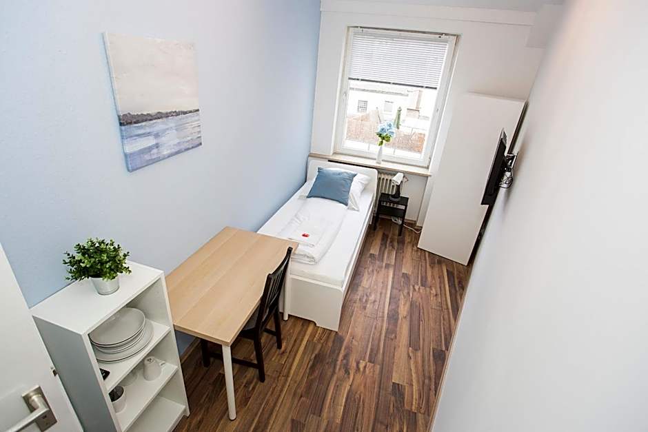 Zentral gelegene Zimmer mit Gemeinschaftsbad und Küche