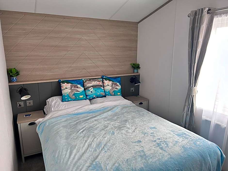 Award winning Serenity Lodge with outstanding lakeside views from the hot tub , at Tallington Lakes Leisure Park, Stamford