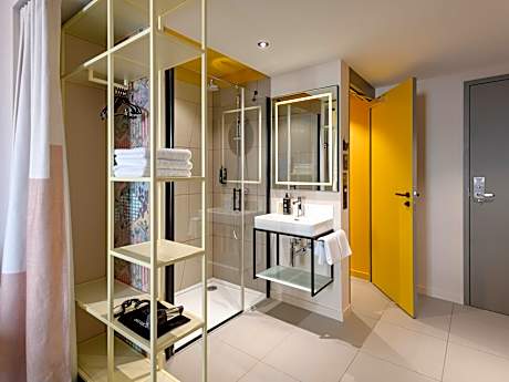 Standard room with 2 single size beds and sofa bed
