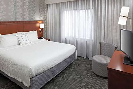 One-Bedroom King Suite with Sofa Bed and Courtyard View