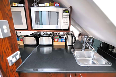 Suite - 1 King 2 Singles, Non-Smoking, Superior Room, Jetted Tub, Split Level, Microwave And Refrigerator