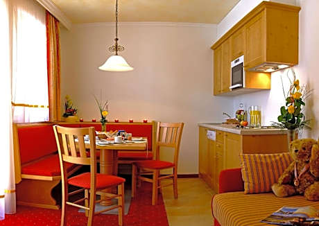 One-Bedroom Apartment with Balcony (2 Adults + 2 Children)