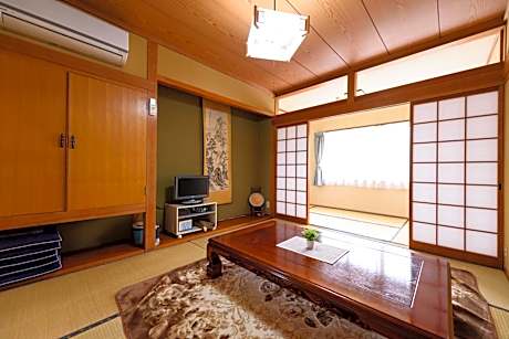 Japanese-Style Family Room with Shared Bathroom