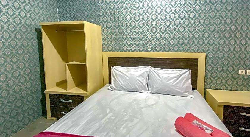 Tini's Guest House Malang Mitra RedDoorz