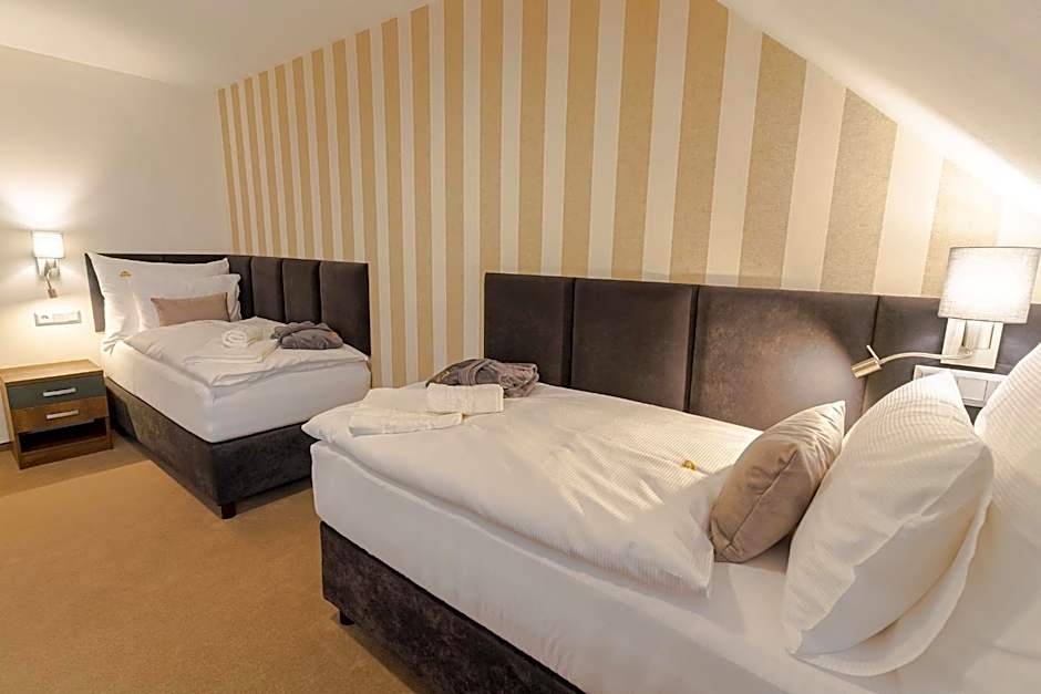 Photo 1 sur 7 de Triple Room with Private Bathroom