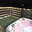 Award winning Serenity Lodge with outstanding lakeside views from the hot tub , at Tallington Lakes Leisure Park, Stamford
