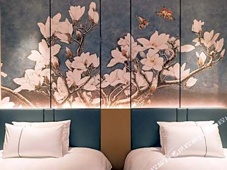Magnolia Hotel (Xingcheng Central Plaza Wenquan Street store)