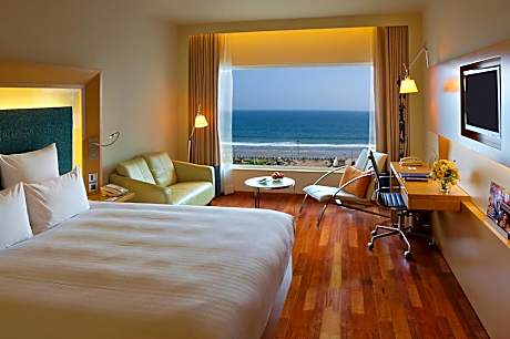 Premier Room with 1 King Bed Ocean View with Premier Lounge Access along with 2 Pieces of Laundry per room per night on non-cumulative basis.