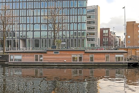 HouseBoat next to AMSTEL