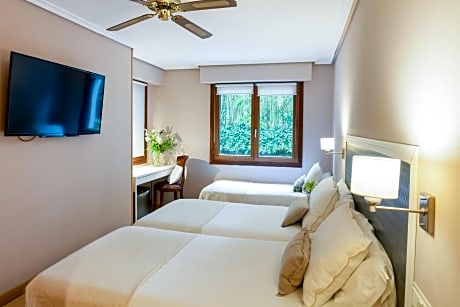 Habitación Triple Parking Gratuito