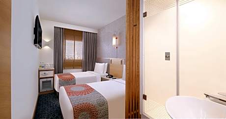 Standard Twin Room - High Floor with Laundry Discount: 10%, Welcome Drink: Nonalcoholic (choice of one aerated beverage / tea / coffee),Complimentary Early Check-in: From 1:00 pm (subject to availability),Late Check-out: By 2:00 pm (subject to avl)