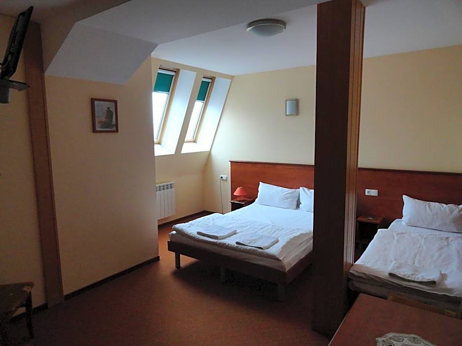 Photo 1 of 3 of Triple Room with Bathroom