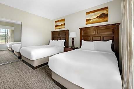 Two-Bedroom Deluxe Suite with One King Bed, Two Double Beds and Balcony