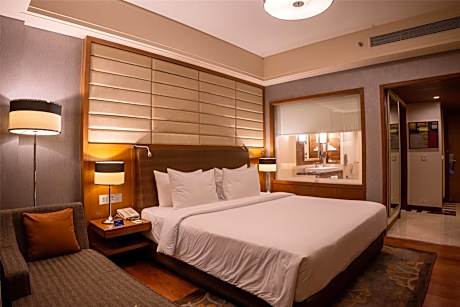 Business Class Room with Two-way Airport Transfer and Complimentary 1+1 Happy Hours from 6pm to 8pm and 15% off on Food & Beverage Services , Laundry Services and Spa