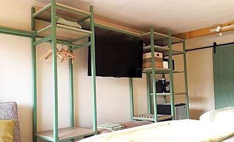 Superior Double Queen Room with Parkway View Shared Balcony with Rocking Chairs