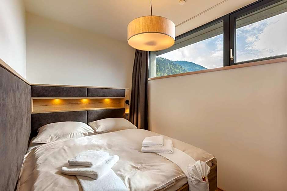 Emma Deluxe Aparthotel, Aircondition, ganzjährig beheizter Außenpool & Skibus direkt vor der Tür