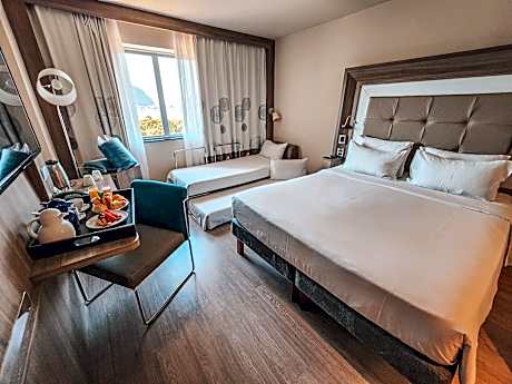 Family room with 1 double bed and 1 sofa bed, with view.