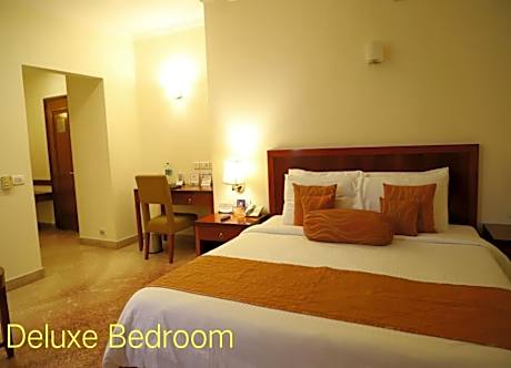 Deluxe Room 1 King Bed with Complimentary tea/coffee service for all our in-house guest at the poolside with some popular evening snacks of Siliguri from 5pm to 7pm