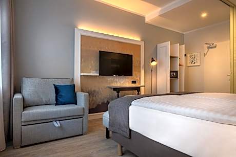 Standard Family Room with One Queen Bed and One Sofa Bed