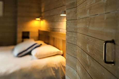 Superior wooden style room with 1 queen size and 1 single beds, with a private terrace or balcony
