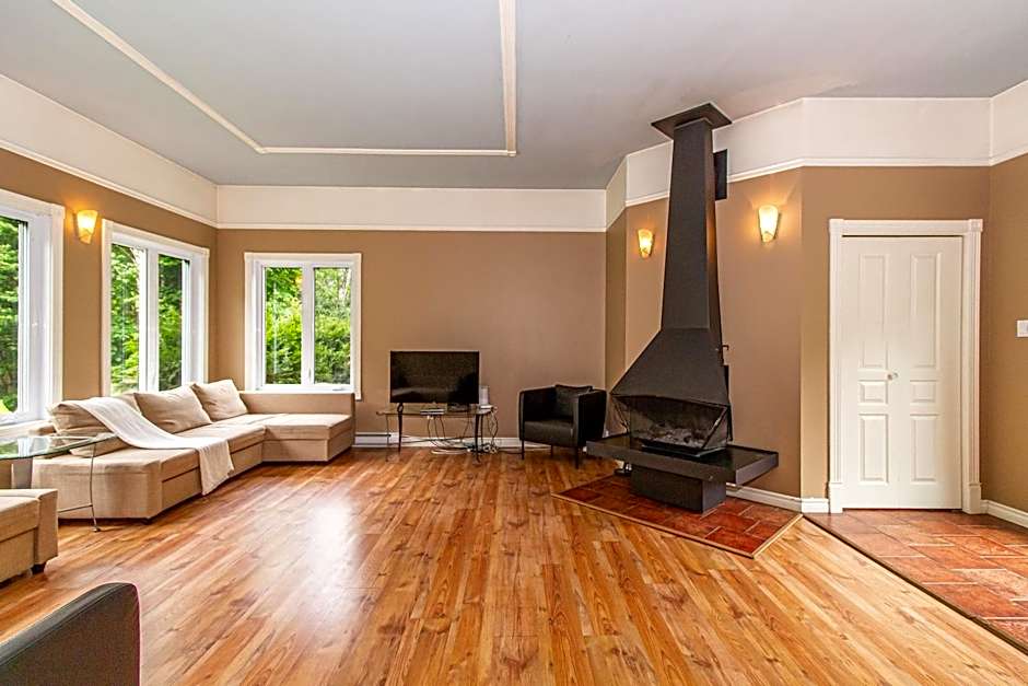 Tranquil Riverfront Chalet with Hot Tub