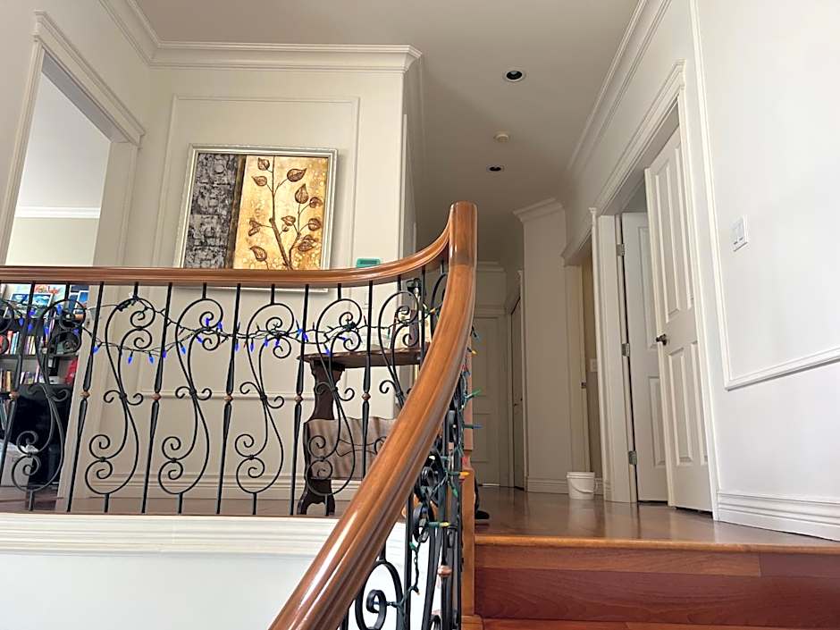 A cozy bedroom with a private washroom close to YVR Richmond