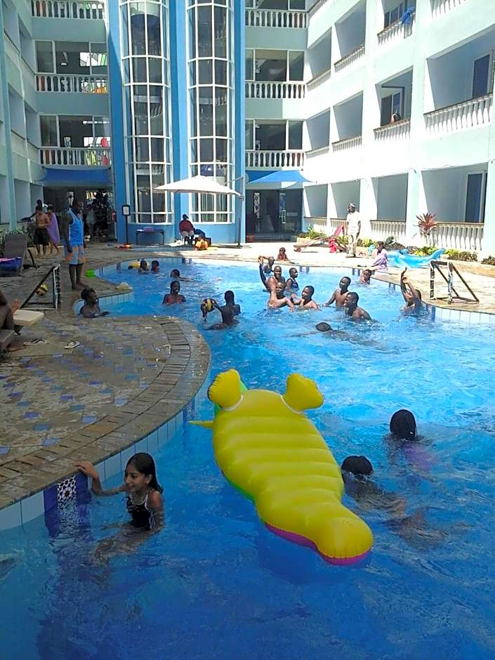 Cowrie Shell Beach Apartments Official
