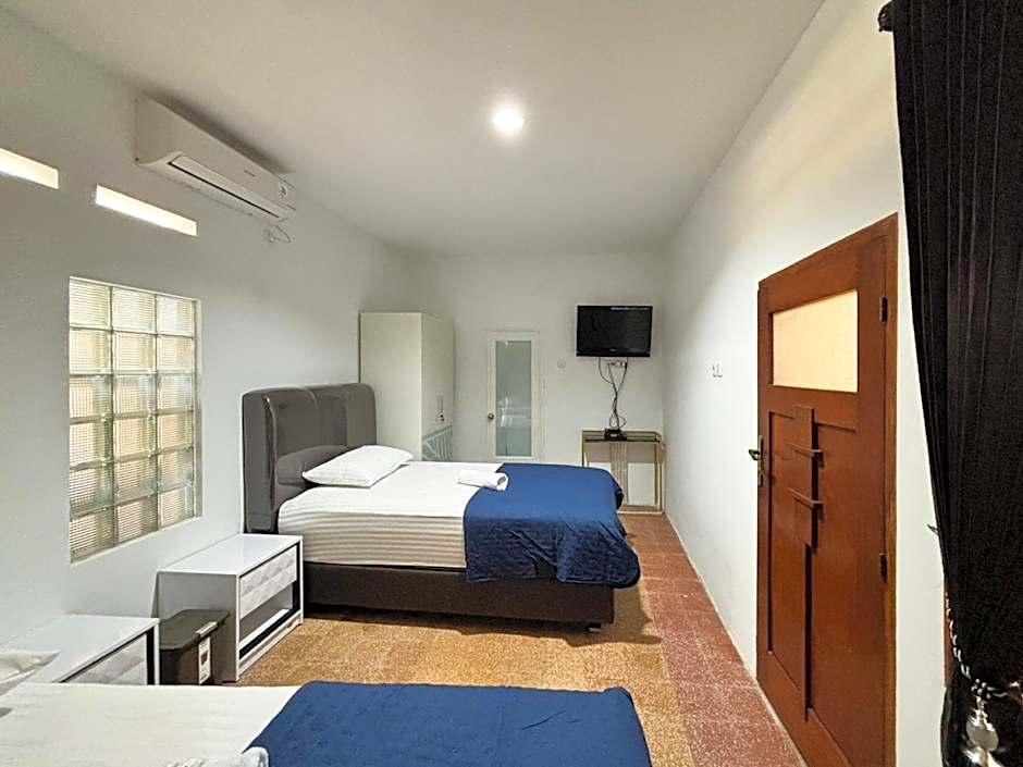 Tini's Guest House Malang Mitra RedDoorz