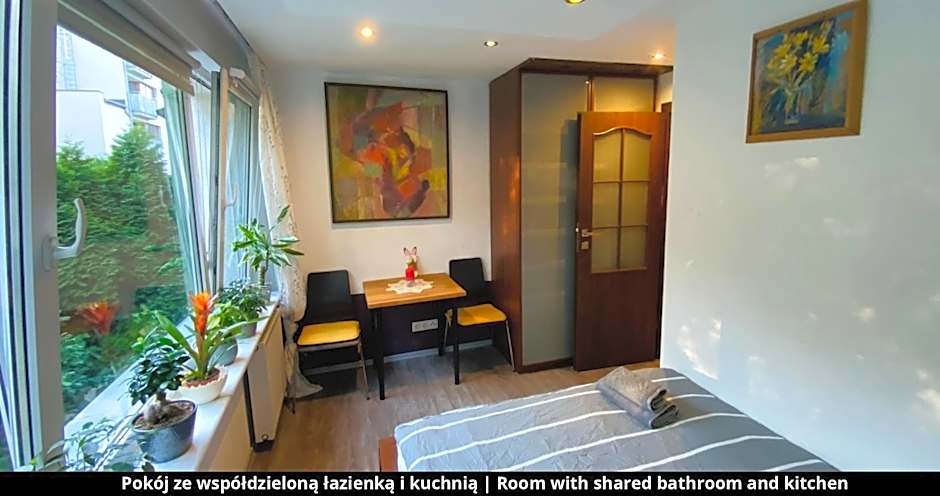 Room with shared bathroom and kitchen