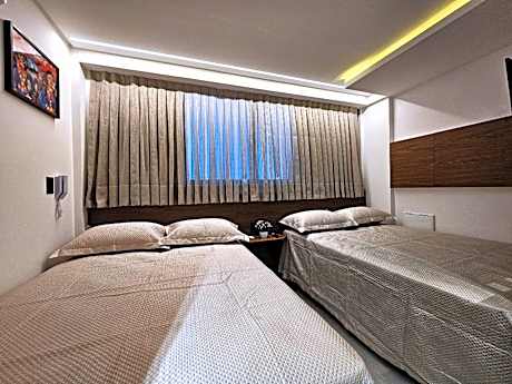 Lindo Flat com 2 camas casal a 50m da praia