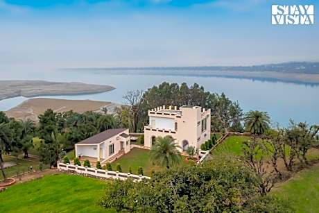 StayVista's Lake Pearl Serenity - Riverside, Mountain-View Villa with Jacuzzi, Sprawling Lawn & Terr