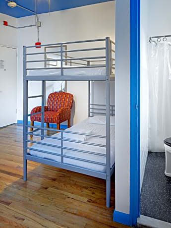 Bed In Dormitory With Shared Bathroom