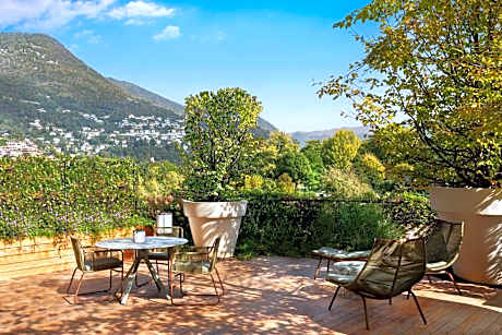 One-Bedroom King Suite with Sofa Bed, Balcony and Pool View