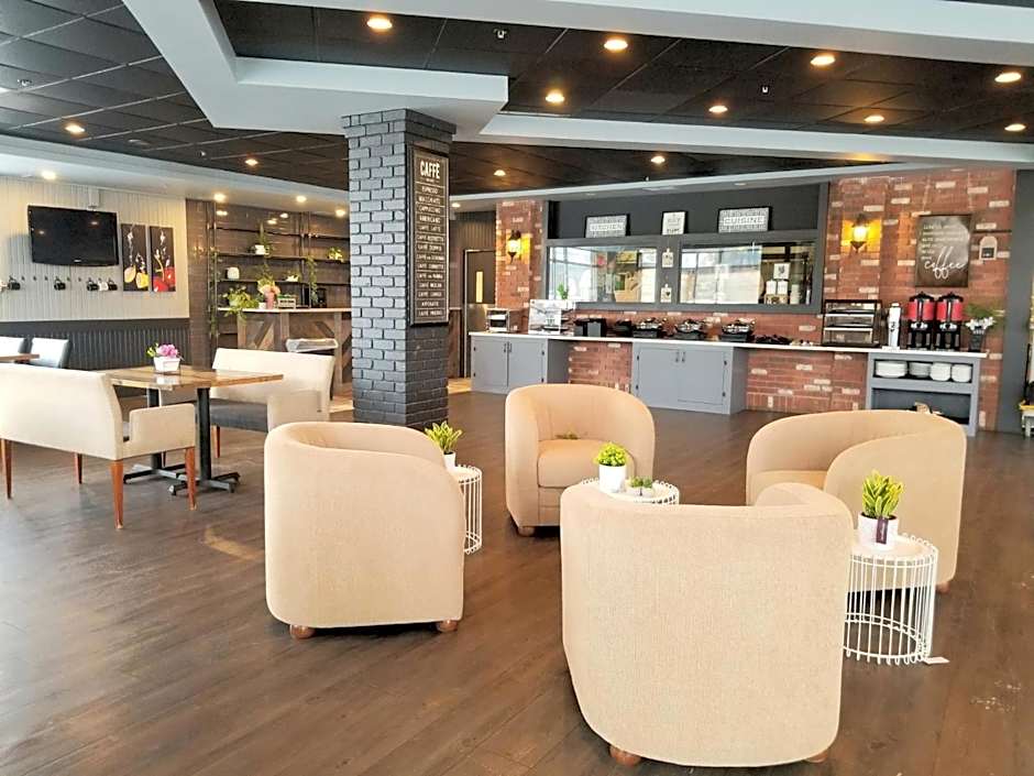 Merit Hotel & Suites