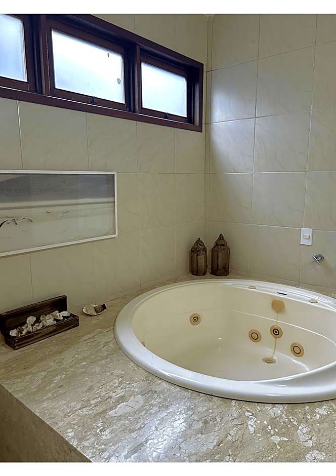 Casa Ilha| beira mar, piscina aquecida, 4 suítes