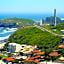 KITNET S2 em TORRES-RS - Na mais bela praia Gaúcha - Cozinha - Banheiro - Ar condicionado - TV smart 32' - Wi-Fi - Estacionamento - Anfitriã Superhost no BnB