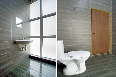 Bed in dormitory with share bathroom