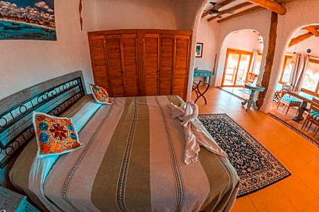 Master Suite King Bed with Partial Ocean View and Balcony