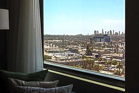 Essential Queen Room with Two Queen Beds and City View