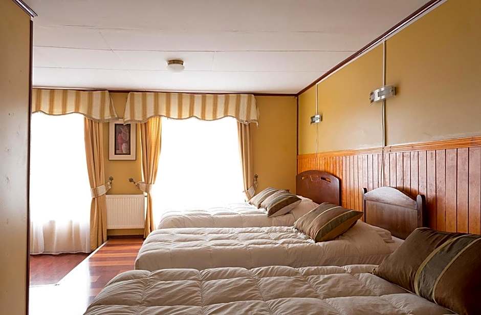 Photo 1 of 12 of Quadruple Room