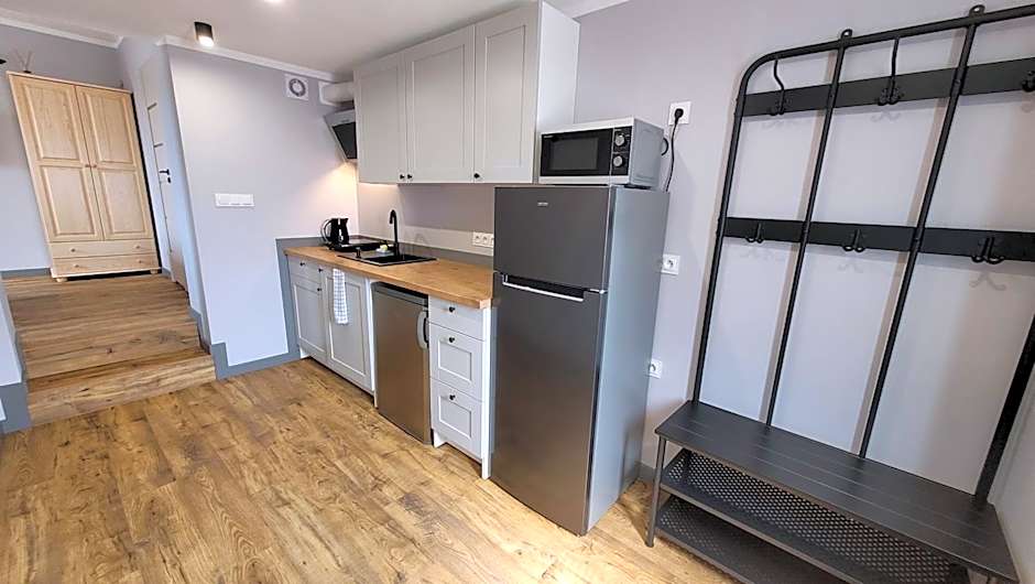Wrzosowe Wzgórze 5 - Studia i Apartamenty