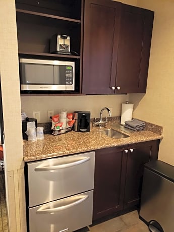 Suite - 1 King 2 Queen Beds, Non-Smoking, Stair Access Only, Pool View, Kitchenette, Balcony, Flat S